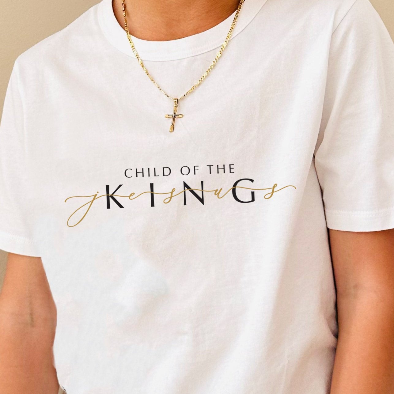 Close up image of the 'Child of the King' tee design on white cotton t-shirt.